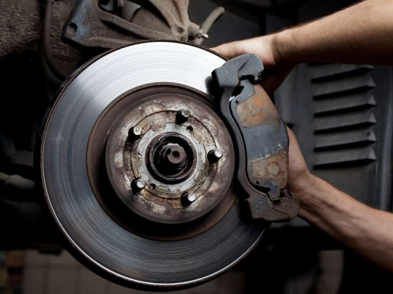Mechanic working on brakes